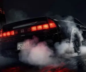 Honda NSX negro derrapando con humo